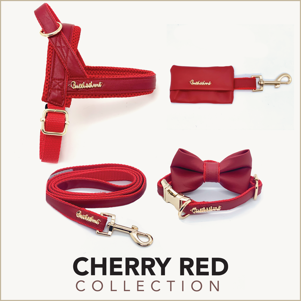 Puccissime Cherry red luxury vegan leather dog accessories matching set. Norwegian one click no pull no choke no mat easy wear dog harness, dog collar bow tie and leash and dog poop bag. MADE IN CANADA.