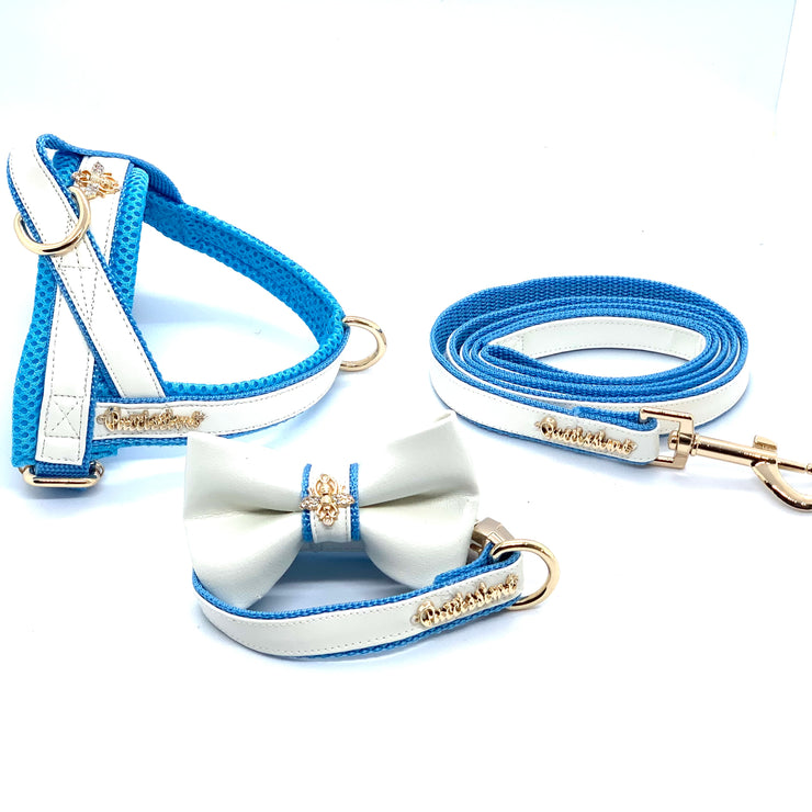 Puccissime My baby boy blue and white luxury vegan leather dog accessories matching set. Norwegian one click no pull no choke no mat easy wear dog harness, dog collar bow tie and leash and dog poop bag. MADE IN CANADA.