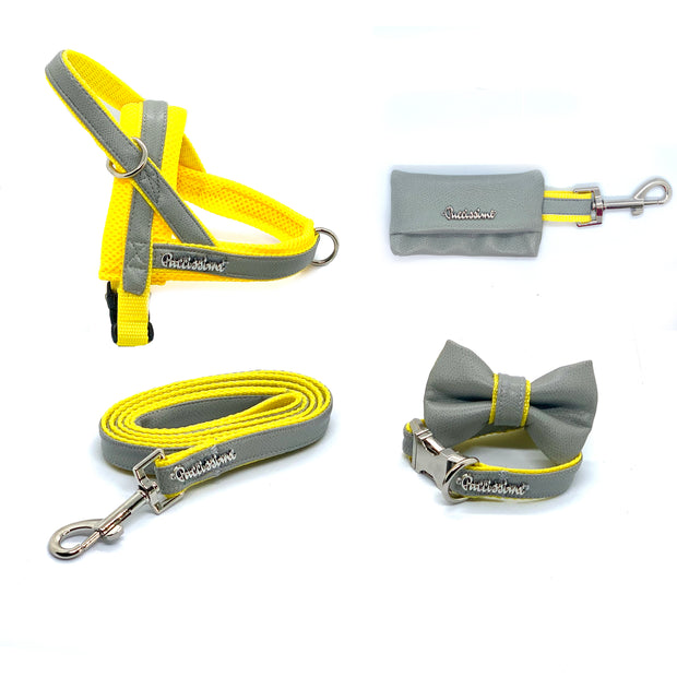 Puccissime Morning mist grey and yellow luxury vegan leather dog accessories matching set. Norwegian one click no pull no choke no mat easy wear dog harness, dog collar bow tie and leash and dog poop bag. MADE IN CANADA.