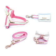 Puccissime My baby girl pink and white luxury vegan leather dog accessories matching set. Norwegian one click no pull no choke no mat easy wear dog harness, dog collar bow tie and leash and dog poop bag. MADE IN CANADA.
