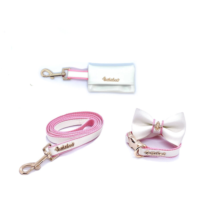 Puccissime My baby girl pink and white luxury vegan leather matching set. Dog collar, bow tie, dog leash and dog poop bag. Made in Canada.