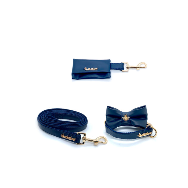 Puccissime Neptune navy luxury vegan leather matching set. Dog collar, bow tie, dog leash and dog poop bag. Made in Canada.