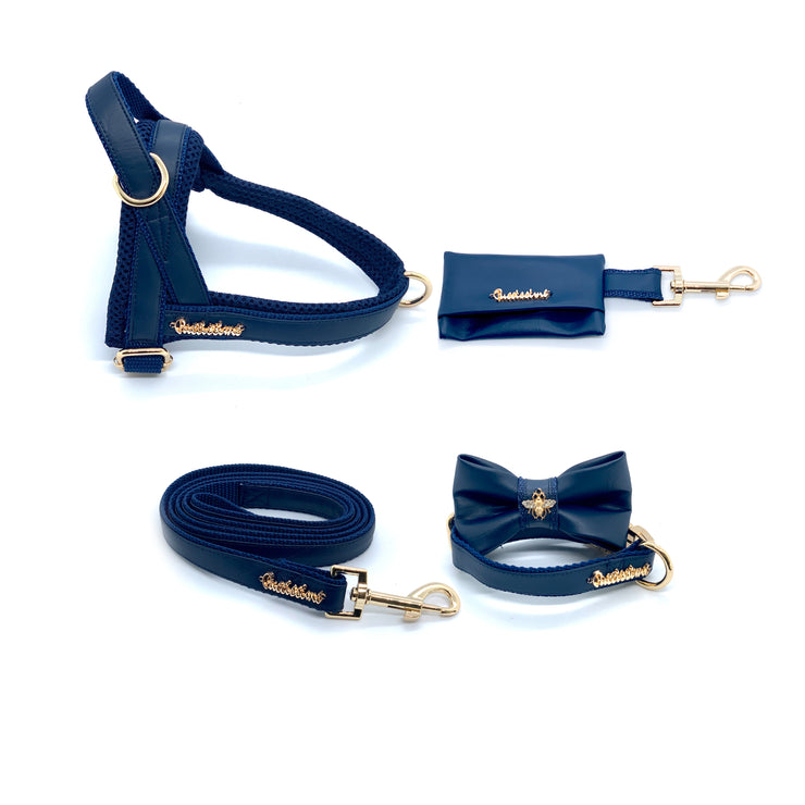 Puccissime Neptune navy luxury vegan leather dog accessories matching set. Norwegian one click no pull no choke no mat easy wear dog harness, dog collar bow tie and leash and dog poop bag. MADE IN CANADA.
