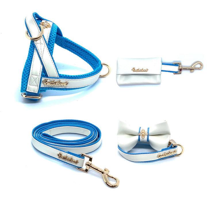 Puccissime My baby boy blue and white luxury vegan leather dog accessories matching set. Norwegian one click no pull no choke no mat easy wear dog harness, dog collar bow tie and leash and dog poop bag. MADE IN CANADA.