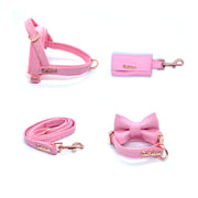 Puccissime Rosie pink luxury vegan leather dog accessories matching set. Norwegian one click no pull no choke no mat easy wear dog harness, dog collar bow tie and leash and dog poop bag. MADE IN CANADA.