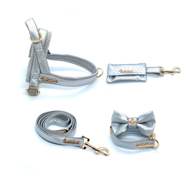 Puccissime Diva silver luxury vegan leather dog accessories matching set. Norwegian one click no pull no choke no mat easy wear dog harness, dog collar bow tie and leash and dog poop bag. MADE IN CANADA.
